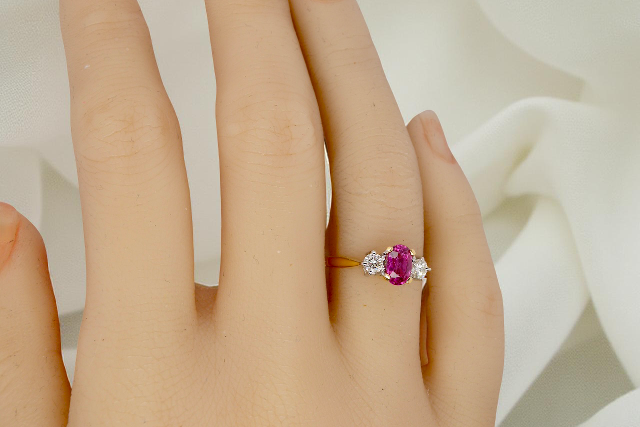 hand A beautifully crafted vintage ruby trilogy ring in rich 18-carat gold