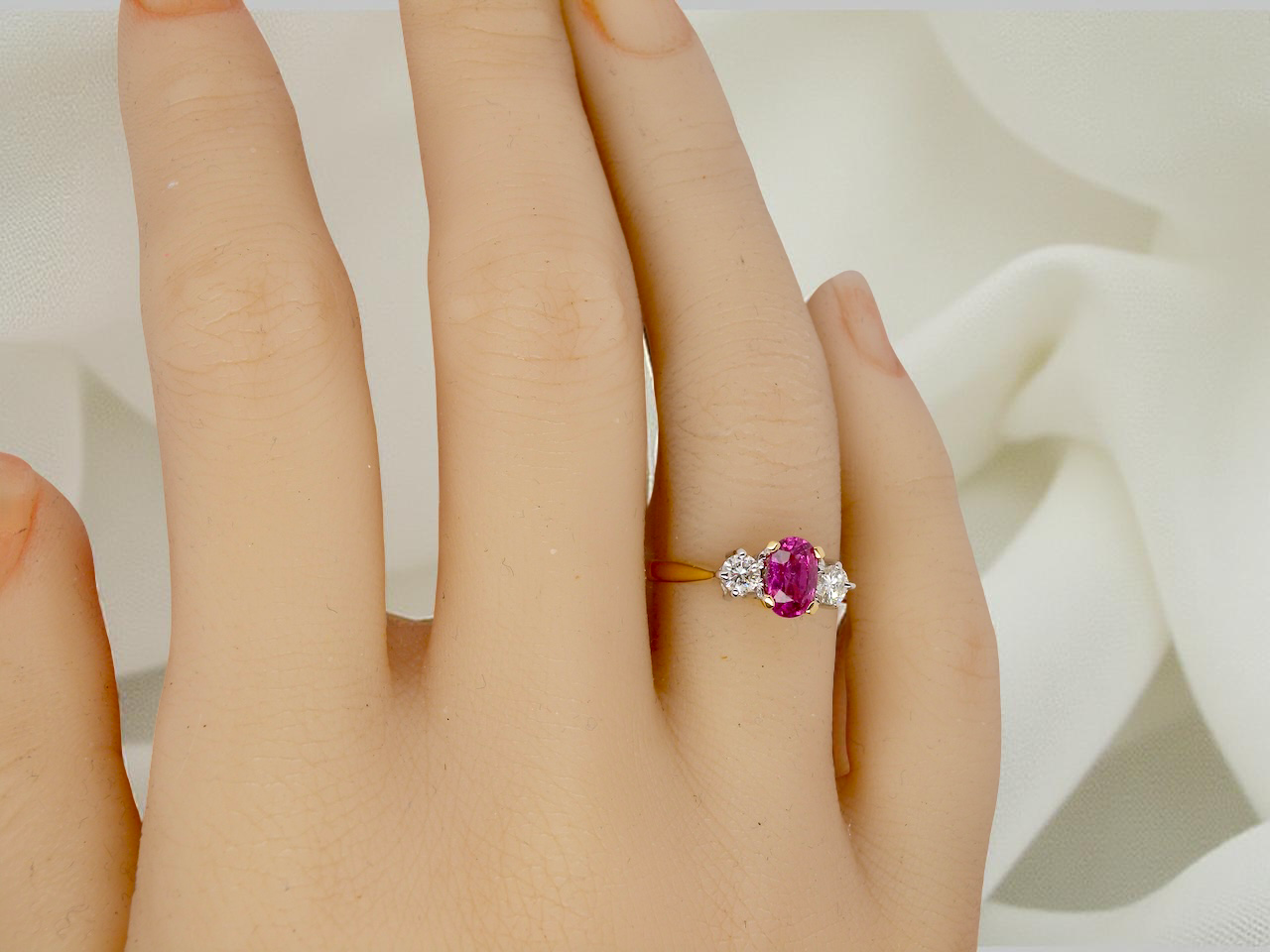 hand A beautifully crafted vintage ruby trilogy ring in rich 18-carat gold
