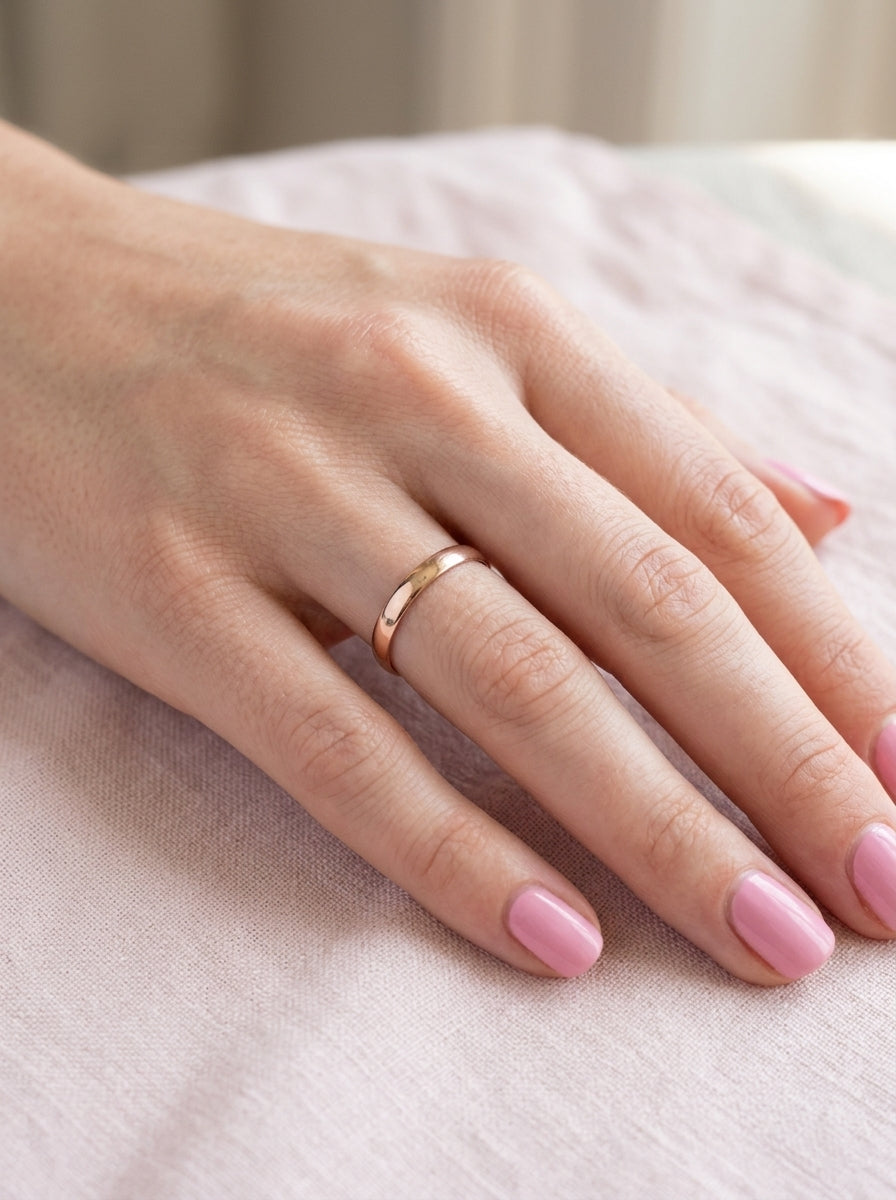 hand A classic 18 carat rose gold wedding ring.
Plain polished finish, 3.8mm wide. weight 2 grams.