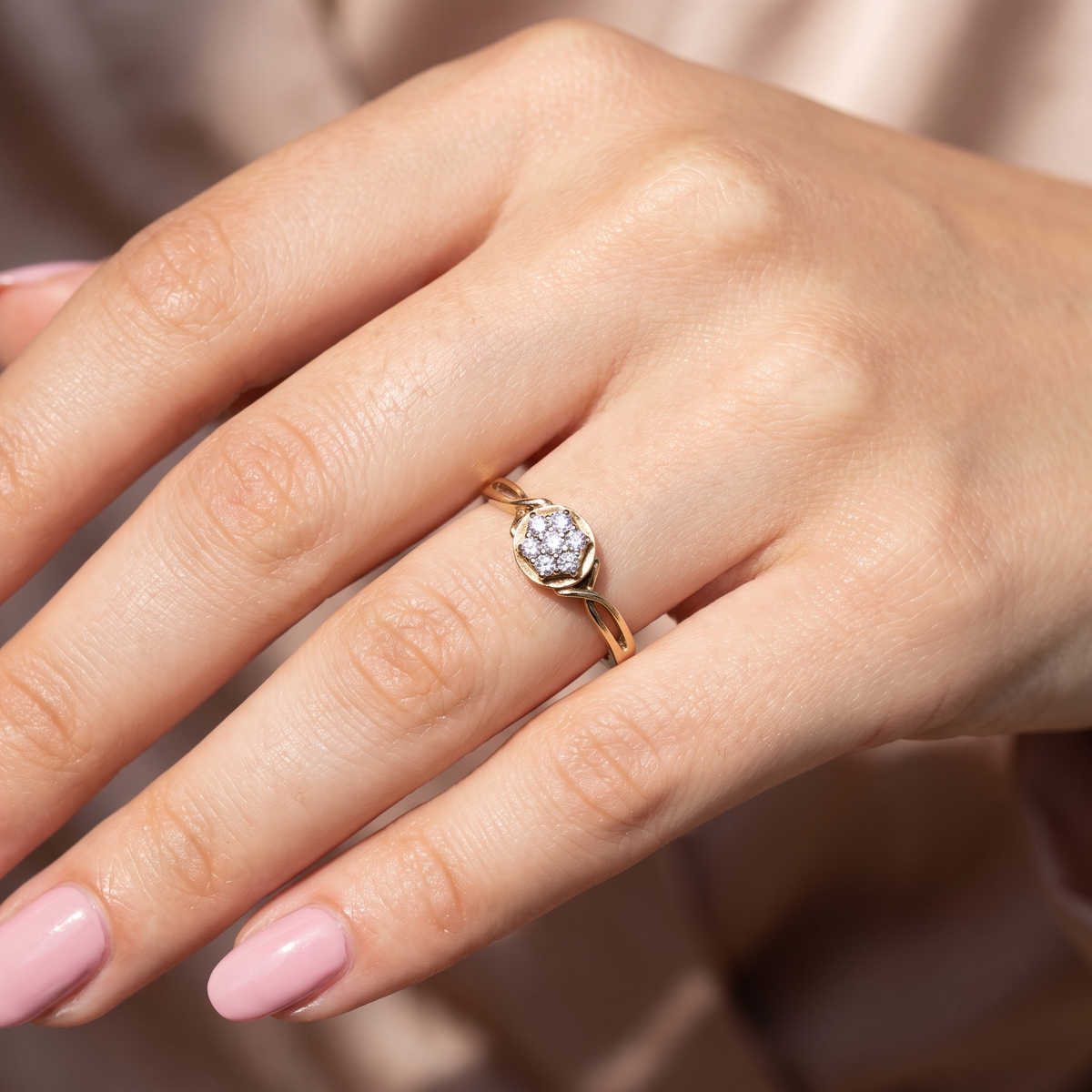 hand A classic 1980s cluster ring. Seven brilliant cut white diamonds , each 2.5mm (est 0.40 carats). Colour i-j, clarity Si. Claw set in white gold.