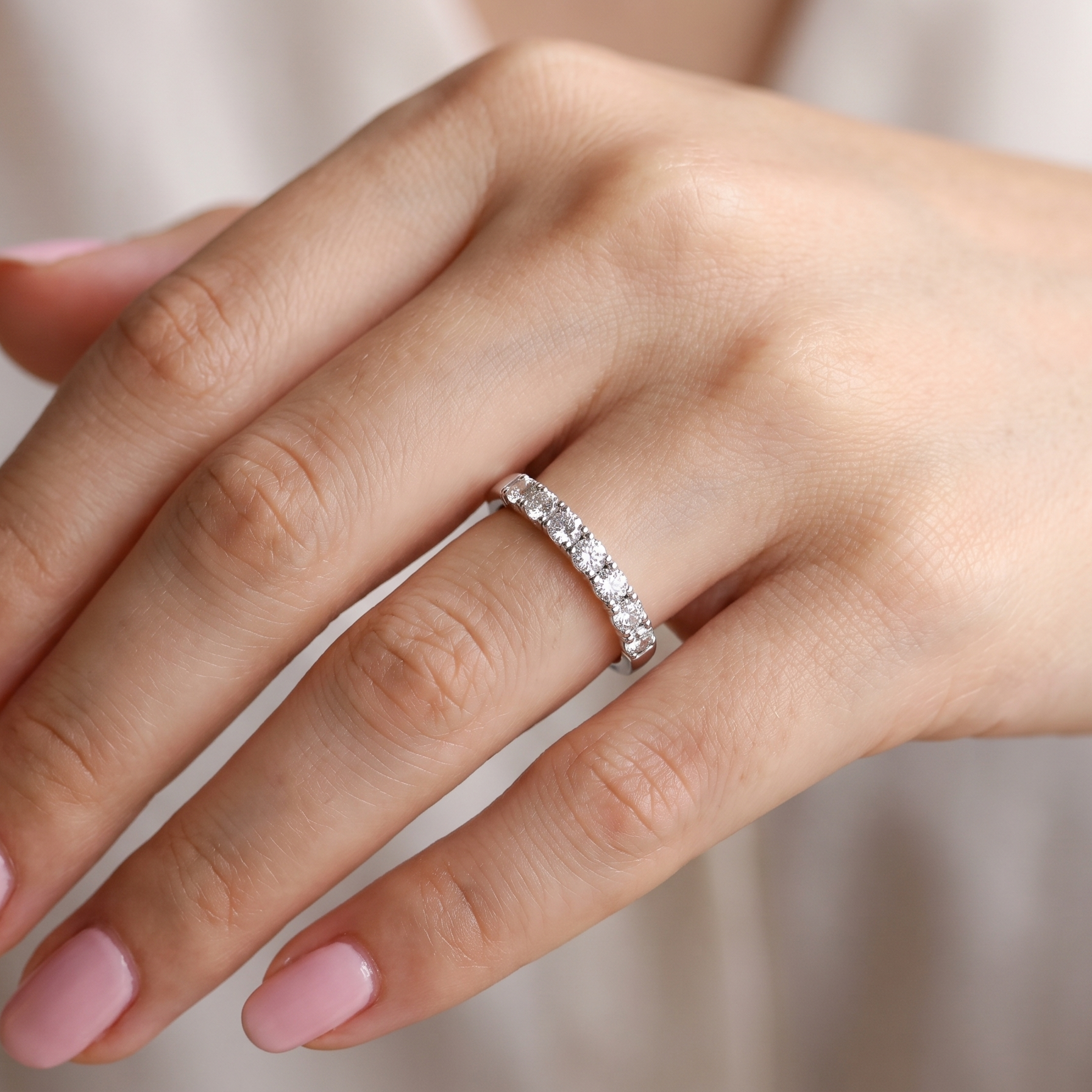 hand A fine seven stone half hoop platinum eternity ring, total measures 0.70 carats