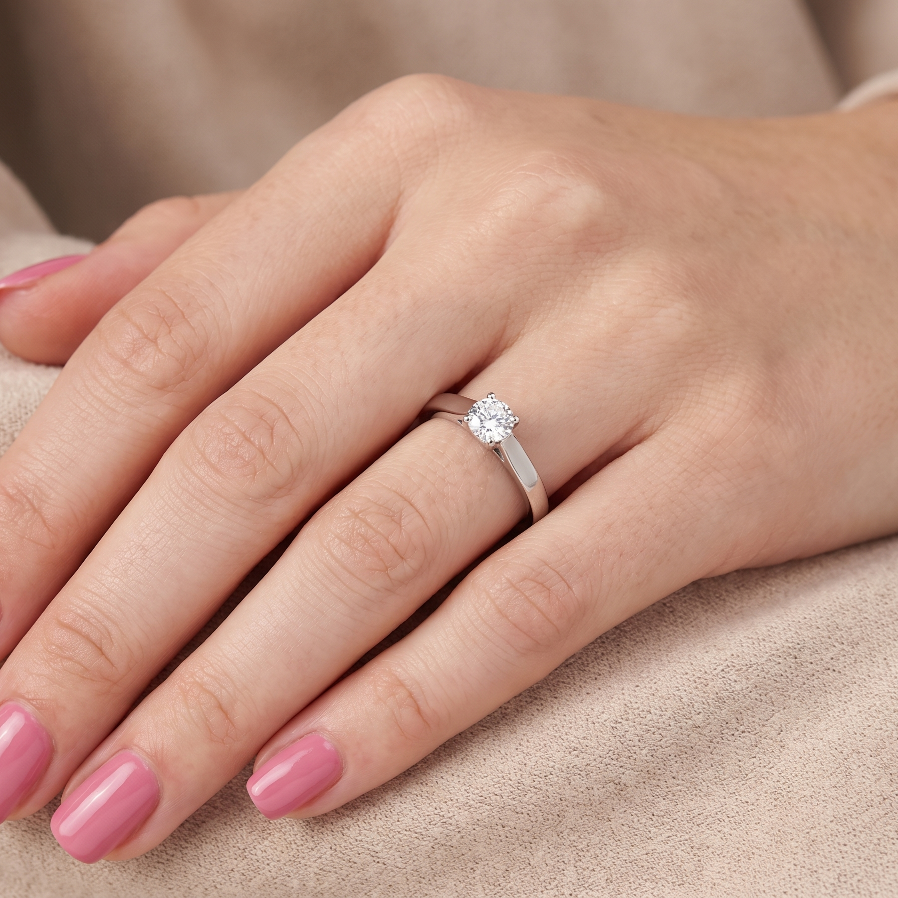 hand A fine solitaire ring, features an exceptional half carat diamond, brilliant cut, colour H-j, clarity VS2-Si1. Measures 5.2mm, depth 5.5mm, weight 4.9grams