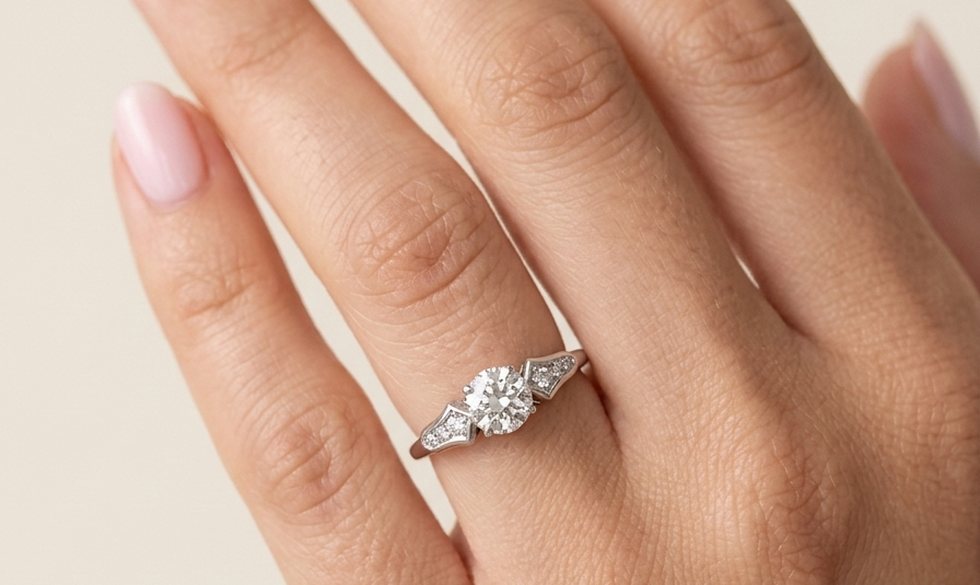 hand A fine solitaire ring featuring an e lovely brilliant cut white diamond. Measures 6.3mm (est 0.85 carats) very bright white stone, colour H-i, clarity VS. Head depth 7mm. 