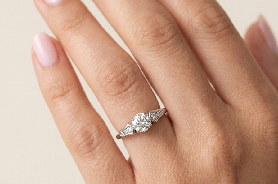 hand A fine solitaire ring featuring an e lovely brilliant cut white diamond. Measures 6.3mm (est 0.85 carats) very bright white stone, colour H-i, clarity VS. Head depth 7mm. 