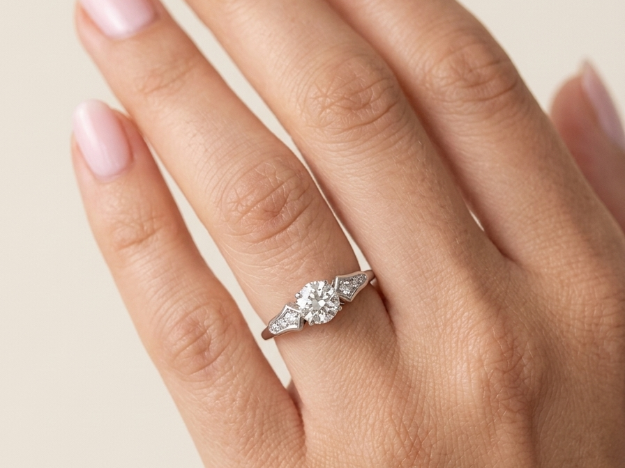 hand A fine solitaire ring featuring an e lovely brilliant cut white diamond. Measures 6.3mm (est 0.85 carats) very bright white stone, colour H-i, clarity VS. Head depth 7mm. 