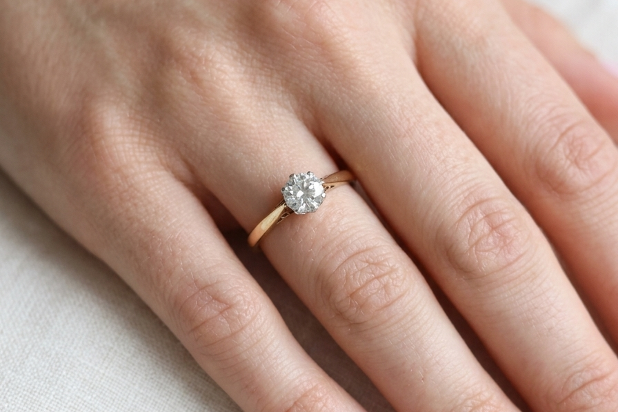 hand A fine solitaire ring set with a brilliant cut white diamond.
Certificated and therefore the description is confirmed. Size 5.5x5.2mm, 0.70 carats. Colour G, clarity Si1.