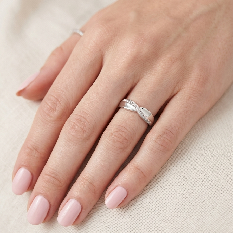 hand A half hoop 9 carat white gold eternity ring. Set with five small white diamonds, each 1.3mm (total 0.05 carats)