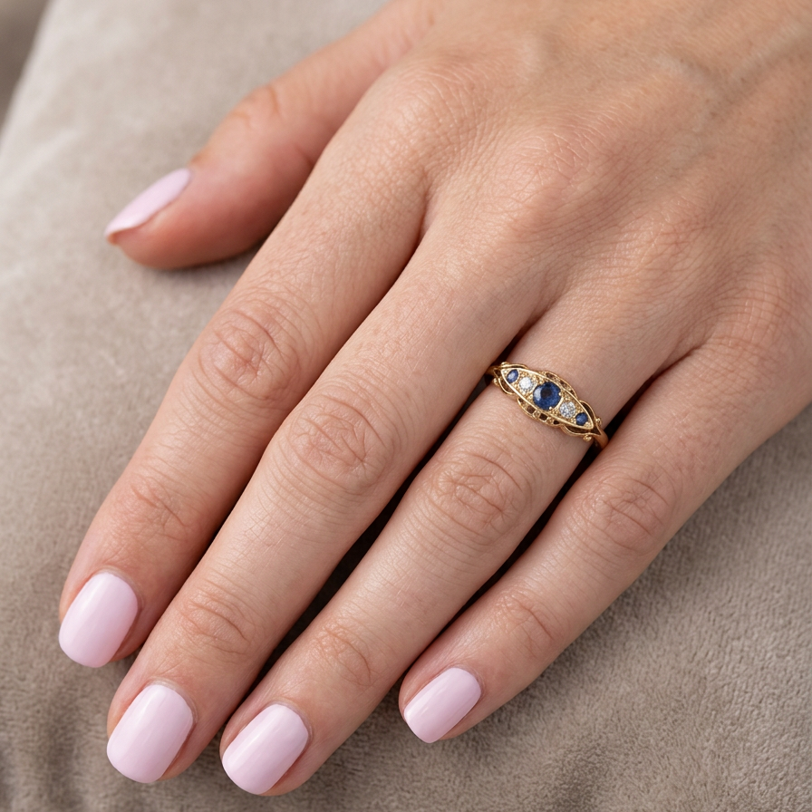 hand A lovely antique ring from the Edwardian period. Hallmarked in Chester in 1909 this ring typical for the period is set with sapphires and diamonds.