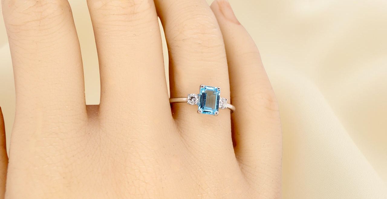 hand A 9 carat white gold three stone ring. This ring is from our Heirloom Collection. This is when we take a stone from a pre-owned ring that is worn out, and reset it into a brand new setting.