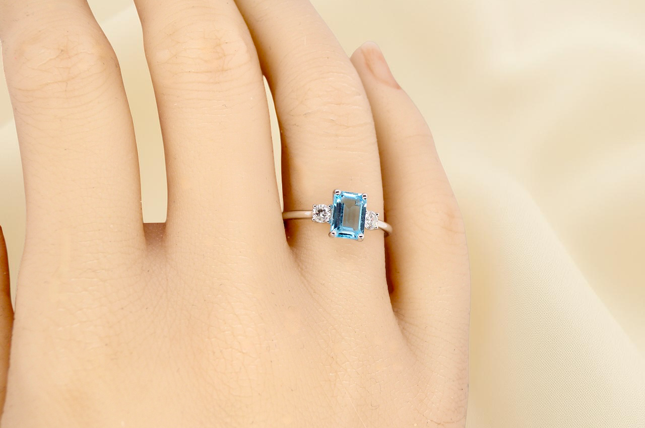hand A 9 carat white gold three stone ring. This ring is from our Heirloom Collection. This is when we take a stone from a pre-owned ring that is worn out, and reset it into a brand new setting.
