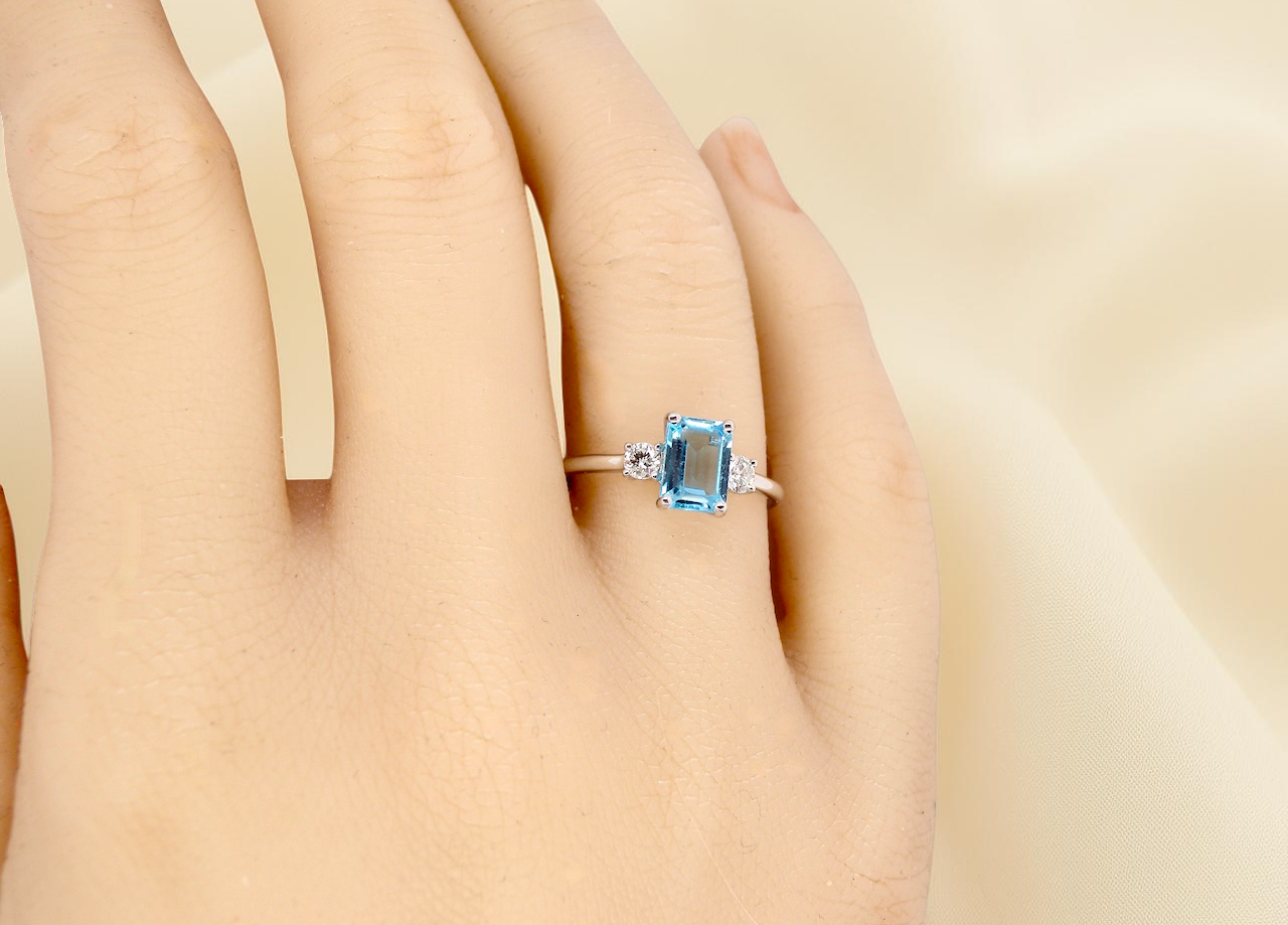 hand A 9 carat white gold three stone ring. This ring is from our Heirloom Collection. This is when we take a stone from a pre-owned ring that is worn out, and reset it into a brand new setting.