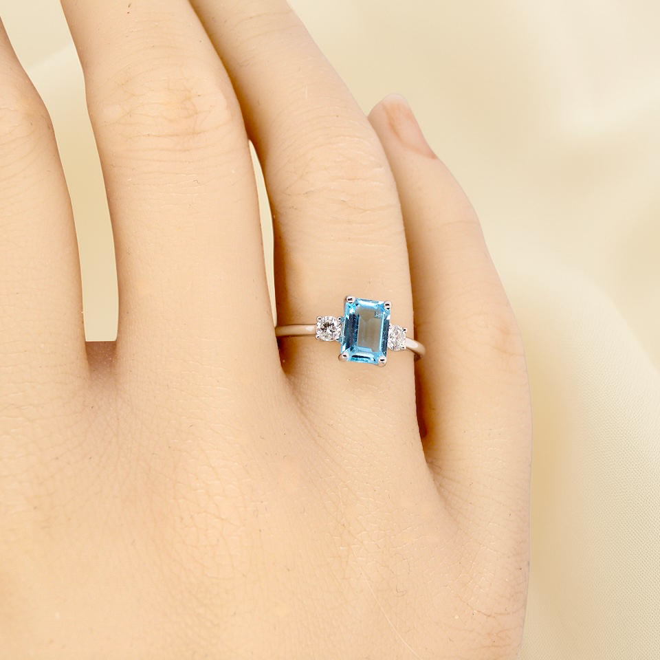 hand A 9 carat white gold three stone ring. This ring is from our Heirloom Collection. This is when we take a stone from a pre-owned ring that is worn out, and reset it into a brand new setting.