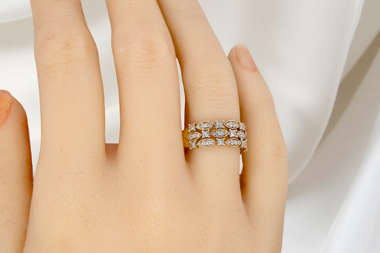 hand A striking half-hoop style ring featuring three diamond-set bands