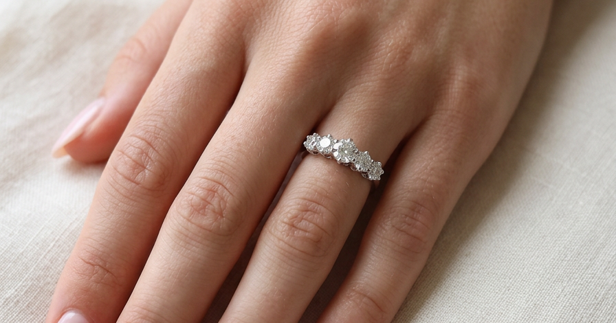 hand A stunning half hoop ring featuring five exceptional brilliant-cut white diamonds, expertly claw set in 18ct white gold.
The centre diamond measures approximately 5.8mm (estimated 0.70 carats), flanked by a 5.0mm diamond on each side, with 4.5mm diamonds at each end.