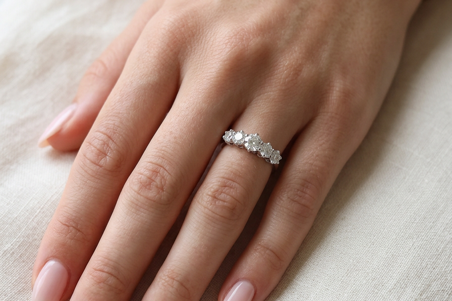 hand A stunning half hoop ring featuring five exceptional brilliant-cut white diamonds, expertly claw set in 18ct white gold.
The centre diamond measures approximately 5.8mm (estimated 0.70 carats), flanked by a 5.0mm diamond on each side, with 4.5mm diamonds at each end.