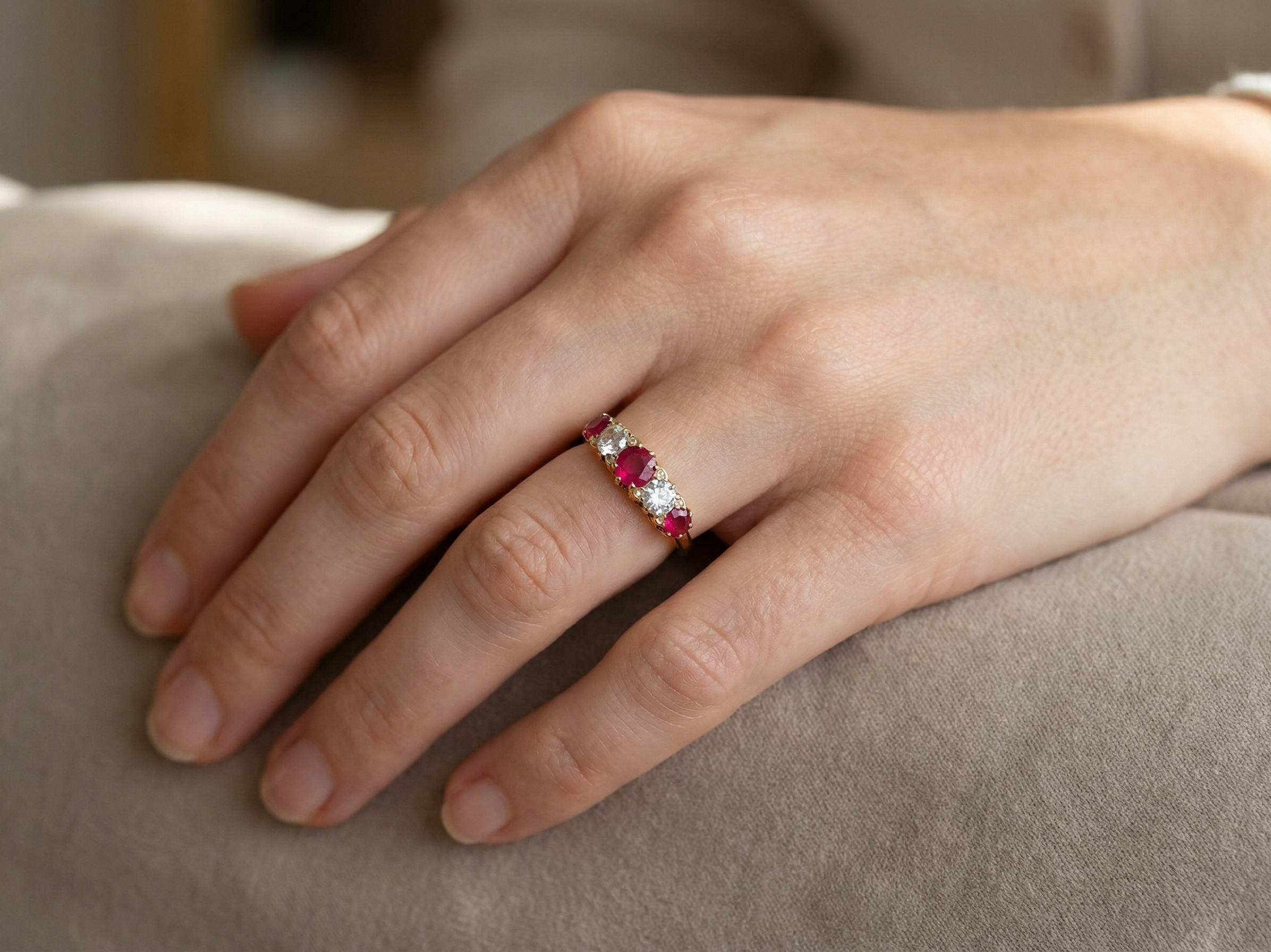 hand A superb Victorian ring, carved boat shaped head. Set with three fine rubies ,