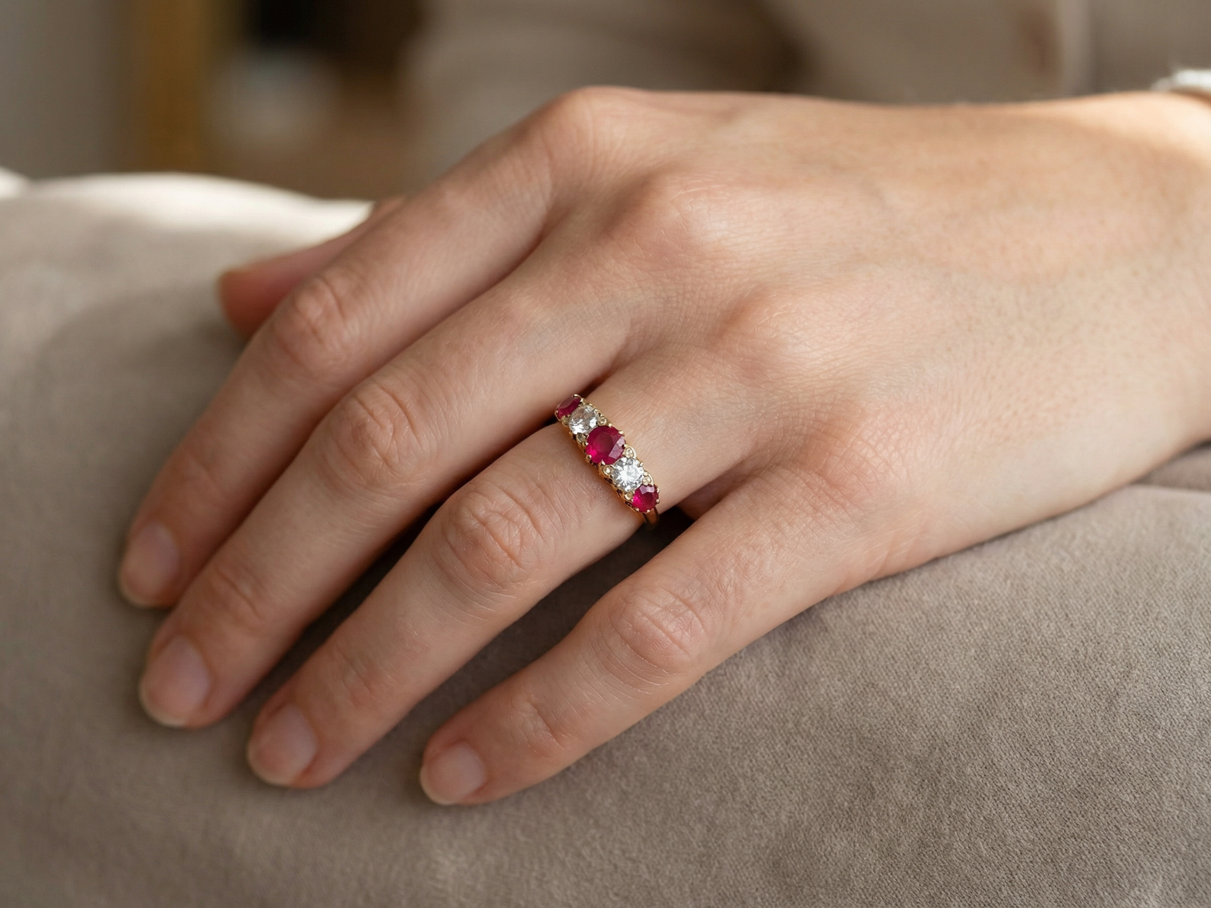 hand A superb Victorian ring, carved boat shaped head. Set with three fine rubies ,