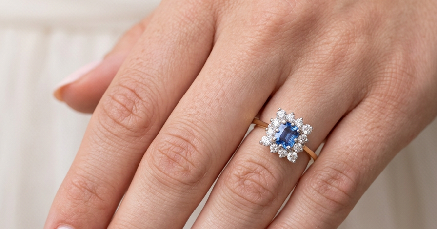 hand A vintage square cluster ring. Features to the centre a square sapphire 5x5mm (est 0.50 carats) mid blue- cornflower hue. 