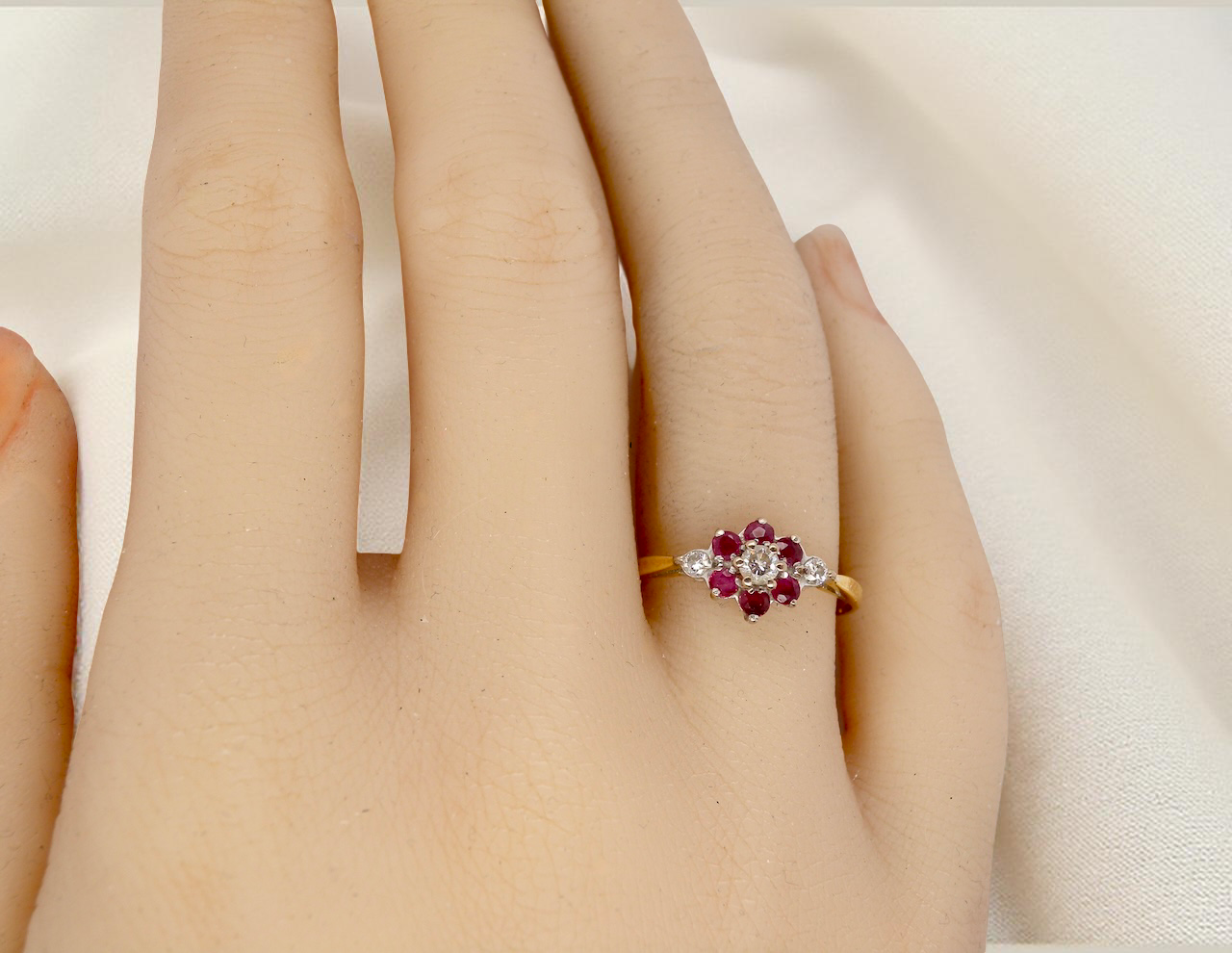 An 18 carat Yellow Gold Diamond and Ruby Cluster Engagement Ring