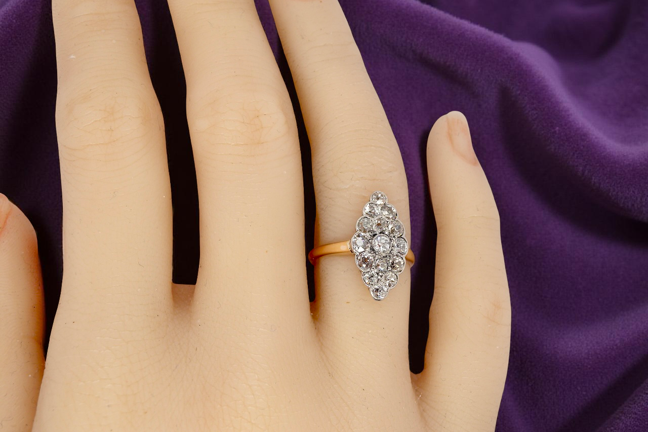 An Antique Marquise shaped Diamond Cluster Ring