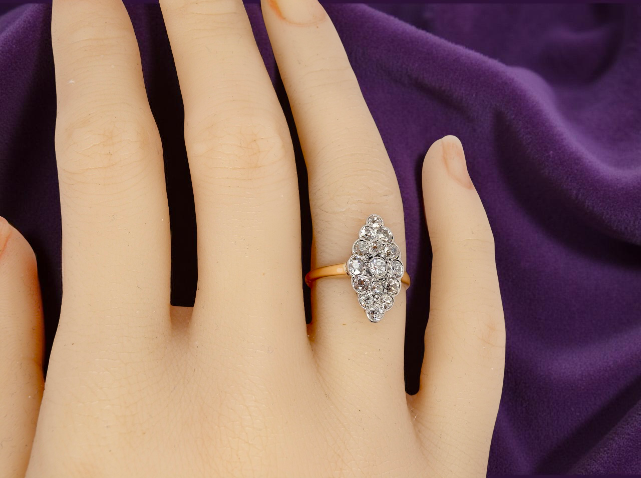 An Antique Marquise shaped Diamond Cluster Ring