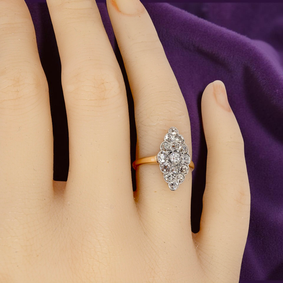 An Antique Marquise shaped Diamond Cluster Ring