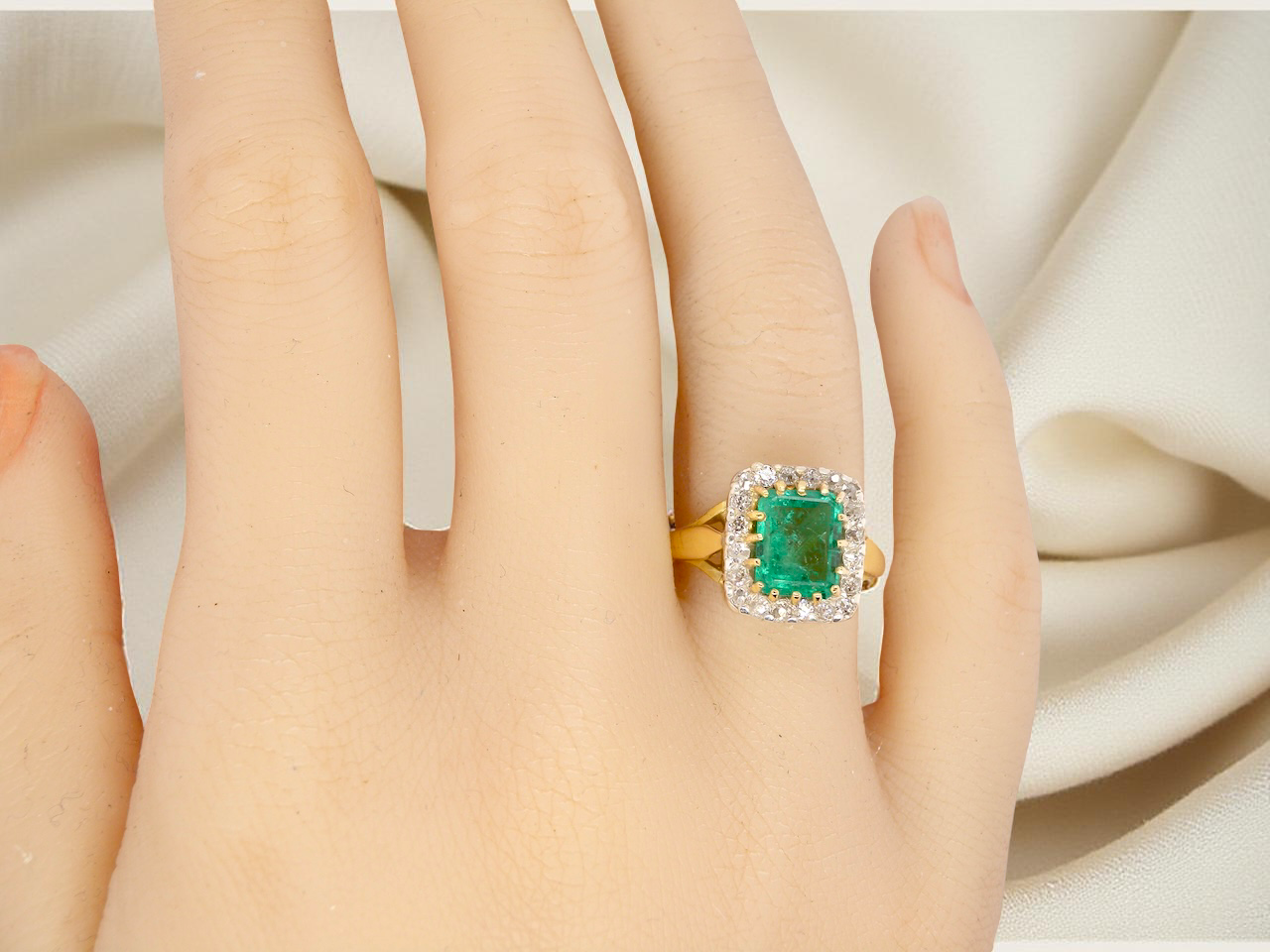 An Emerald and Diamond Cluster Ring, Circa 1950–1960