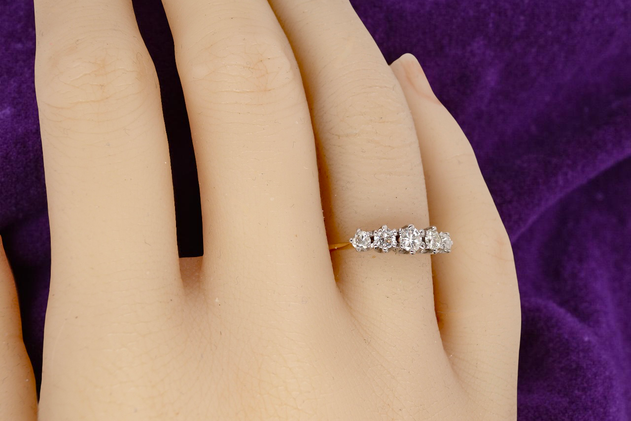 hand An antique five-stone ring dating from the early 20th century,
