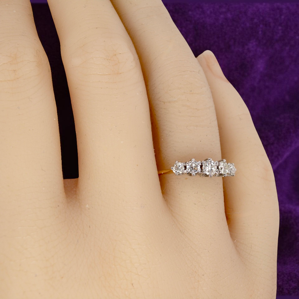 hand An antique five-stone ring dating from the early 20th century,