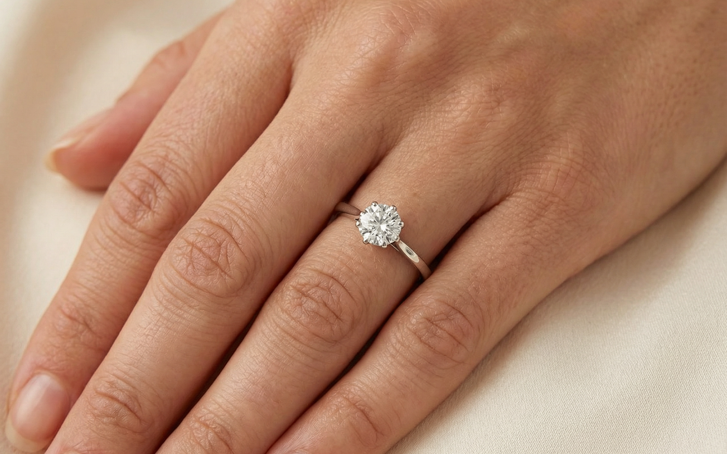 hand An elegant single-stone solitaire ring set with an exceptional brilliant-cut white diamond, estimated at approximately 0.91 carats.