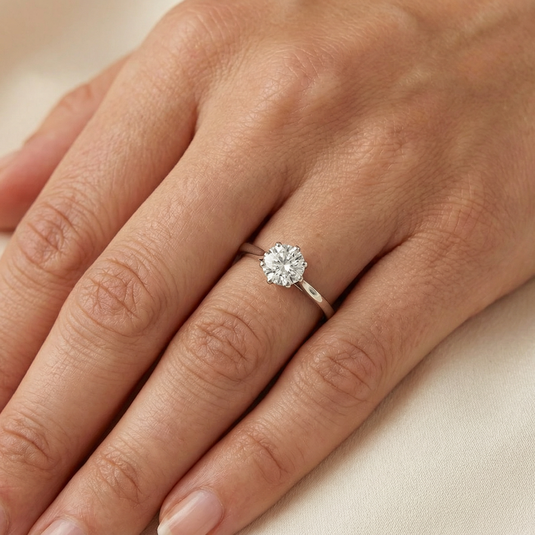 hand An elegant single-stone solitaire ring set with an exceptional brilliant-cut white diamond, estimated at approximately 0.91 carats.