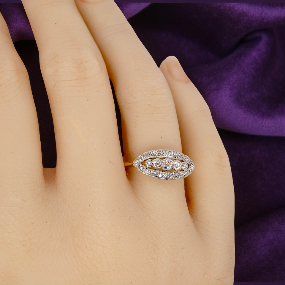 hand An enchanting diamond ring from the early part of the 20th century.
