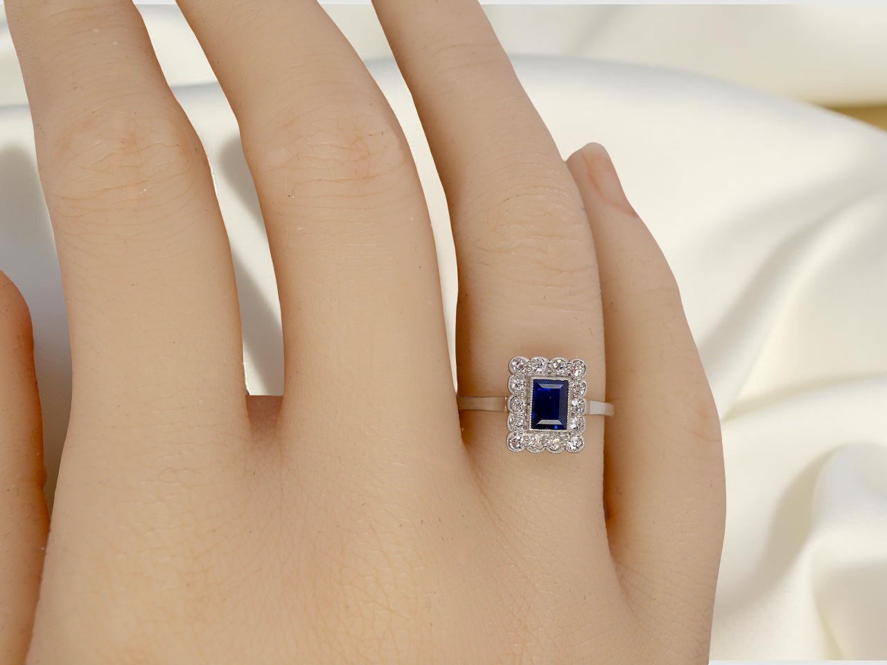 hand Art Deco cluster ring. Features a cobalt blue sapphire
