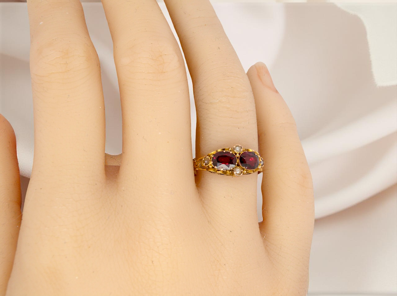 hand Victorian dress ring, beautifully set with two matching oval-cut garnets