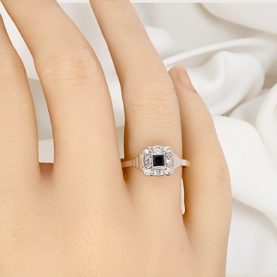 hand antique cluster ring. Features a small square sapphire