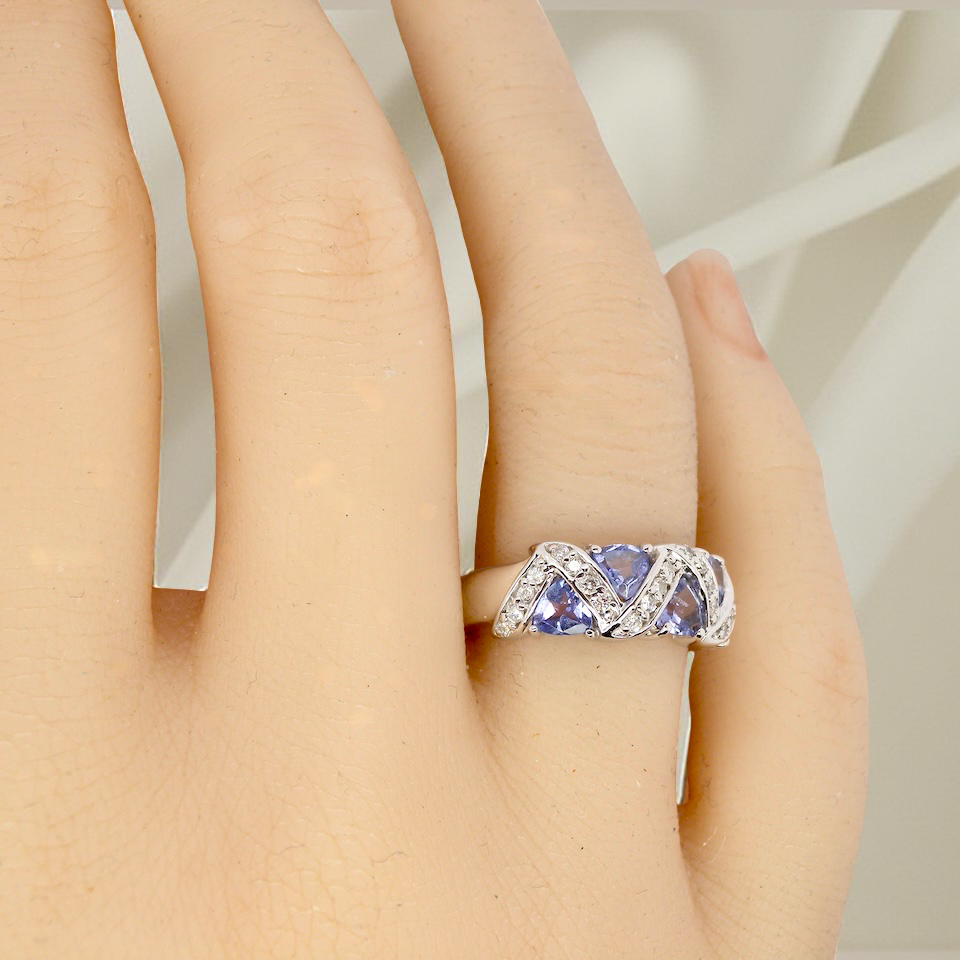 hand beautiful and eye-catching dress ring set in 14ct white gold, featuring five triangular tanzanite gemstones