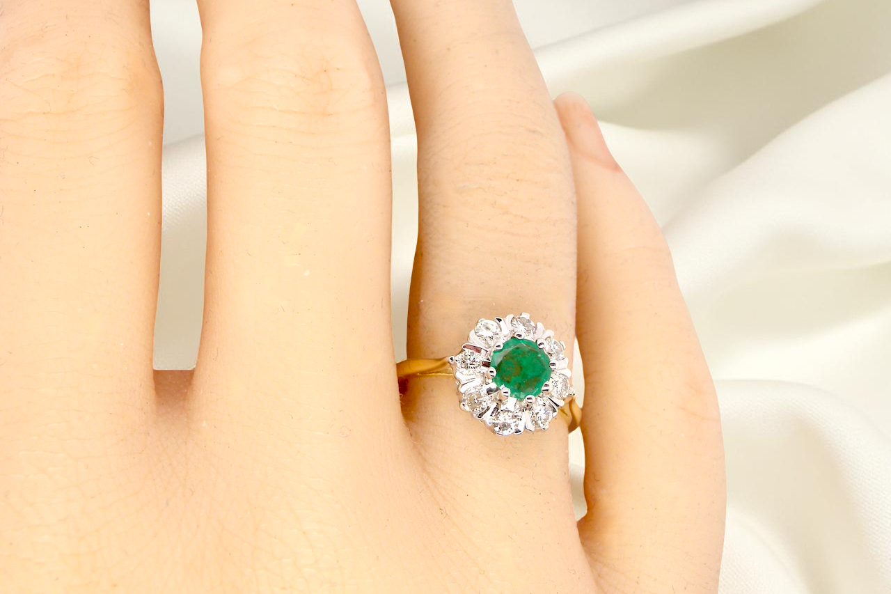 hand beautiful cluster ring featuring a 6mm round emerald