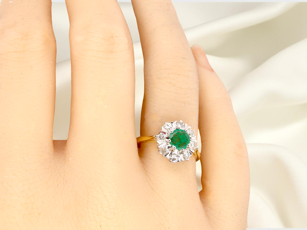 hand beautiful cluster ring featuring a 6mm round emerald