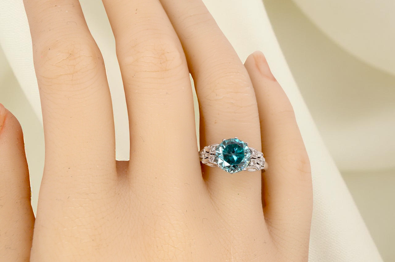 hand fine Art Deco ring that features a stunning natural blue zircon centre stone