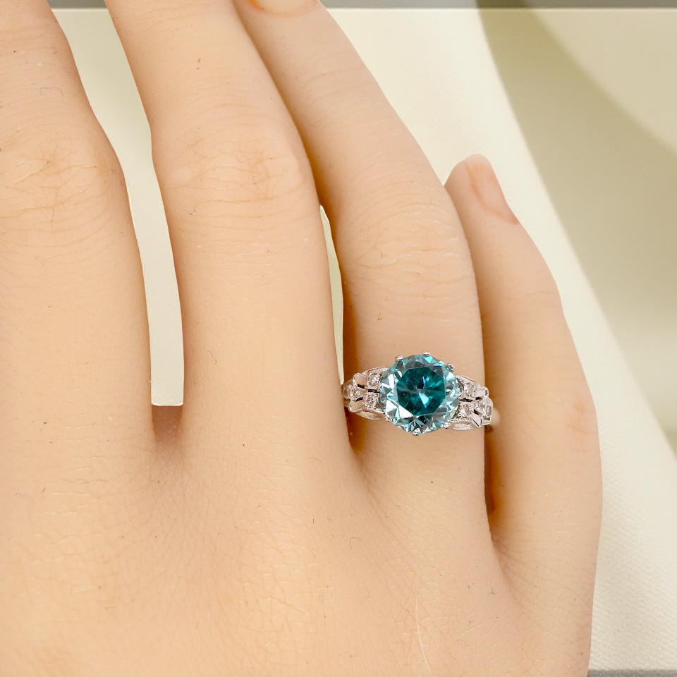 hand fine Art Deco ring that features a stunning natural blue zircon centre stone