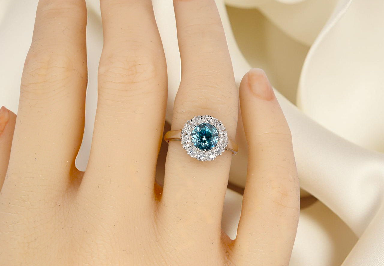 hand fine vintage cluster ring. The centre stone a natural blue zircon, 7mm diameter, bright sparkling refraction to the sky blue hue. 