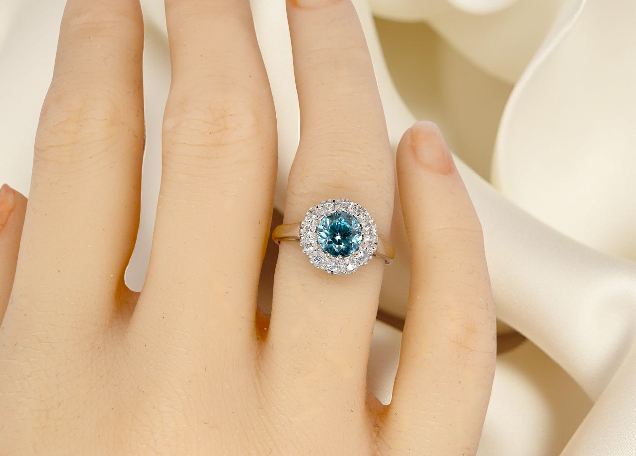 hand fine vintage cluster ring. The centre stone a natural blue zircon, 7mm diameter, bright sparkling refraction to the sky blue hue. 