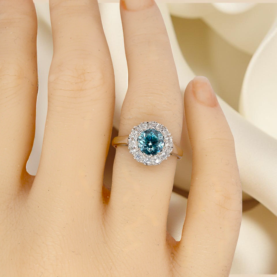 hand fine vintage cluster ring. The centre stone a natural blue zircon, 7mm diameter, bright sparkling refraction to the sky blue hue. 