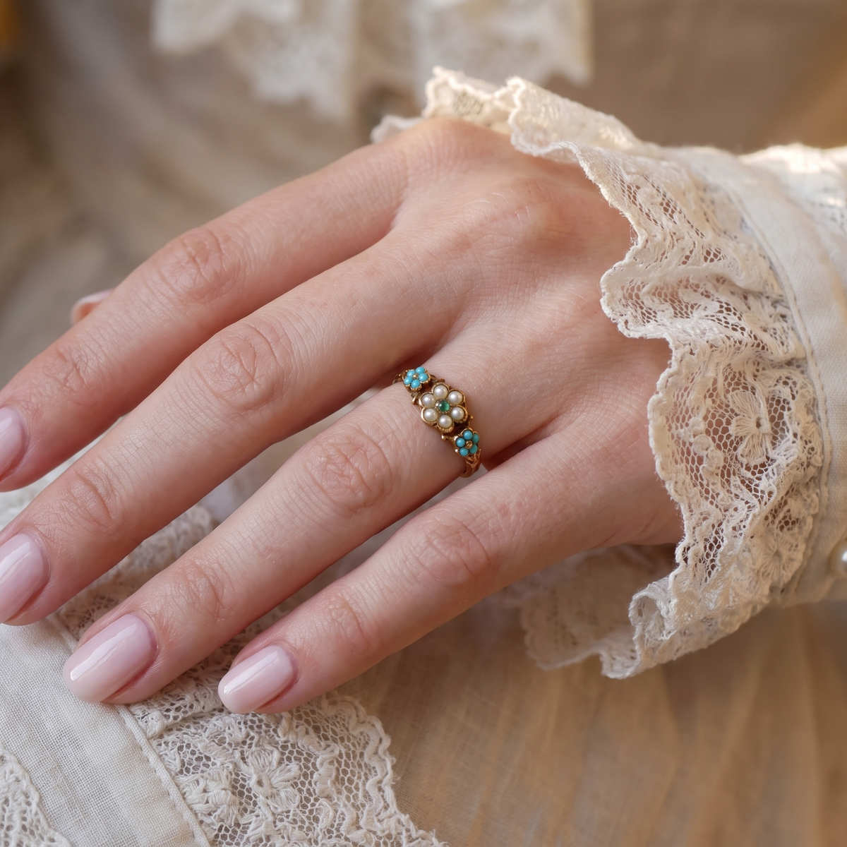 hand pretty Victorian dress ring. A daisy cluster design with an emerald centre stone, measures 1.8mm, surrounded by six tiny seed pearls, each 1.8mm
