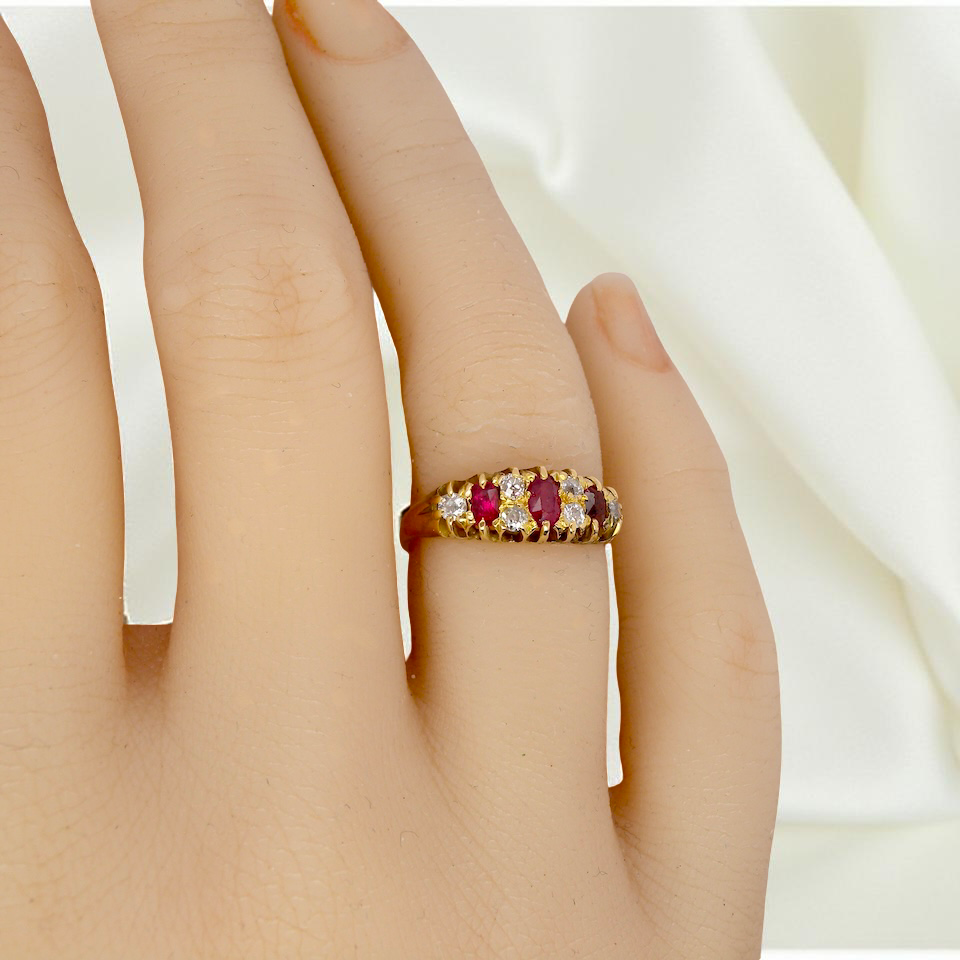 hand typical boat shaped ring from the late Victorian era, probably 1890-1900. This ring is set with three oval cut rubies,