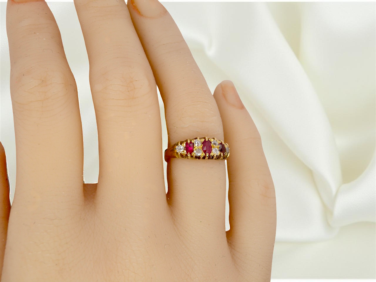 hand typical boat shaped ring from the late Victorian era, probably 1890-1900. This ring is set with three oval cut rubies,