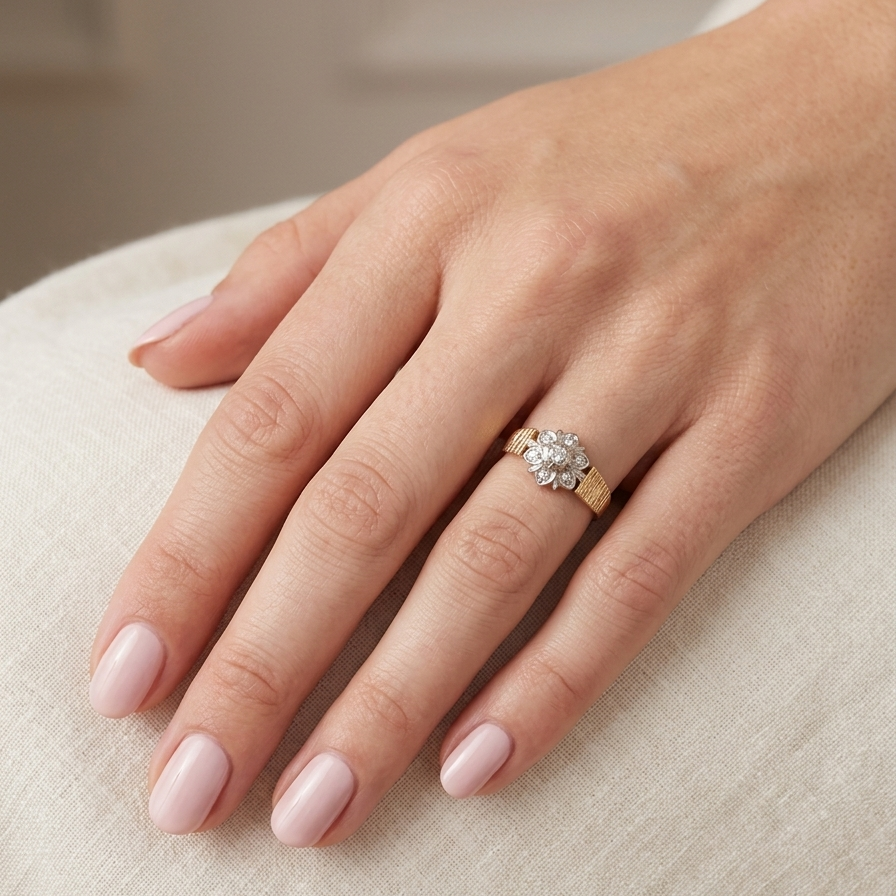 typical design from the 1960s/1970s era, a daisy cluster set with brilliant cut white diamonds a
