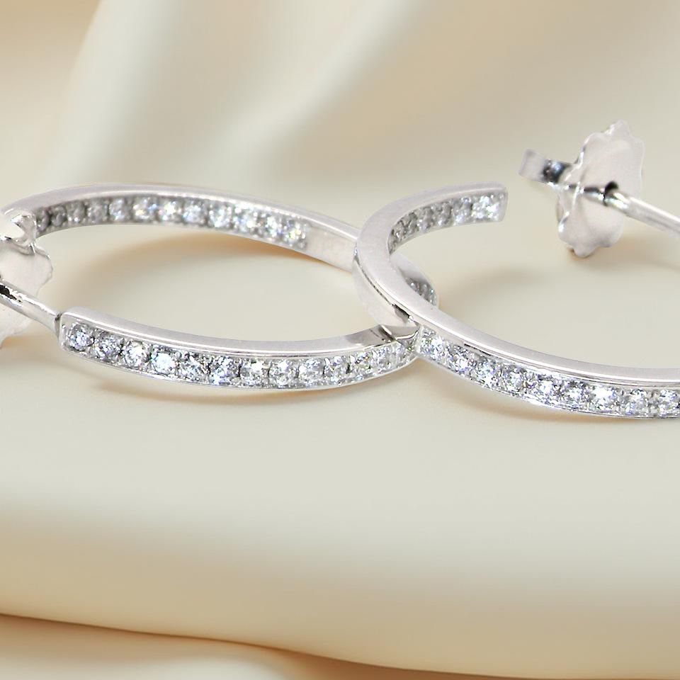hoop earrings by Mappin & Webb, A