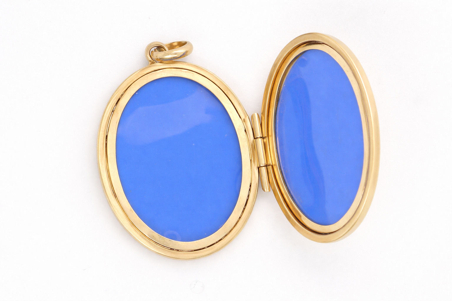 inside A large oval shaped locket. Measures 30x20mm. The front is hand engraved, reverse is plain.