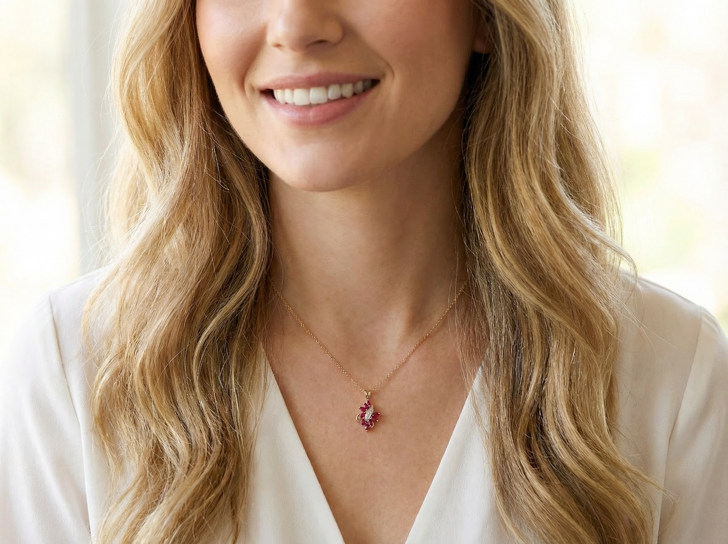 model 9 carat gold pendant. Features nine marquise shaped rubies,